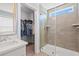 Modern bathroom showcasing a glass-enclosed shower, elegant vanity, and bright natural light at 3751 Copahee Sound Dr, Mount Pleasant, SC 29466