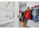 Well-organized walk-in closet and vanity with double sinks and a full length mirror at 3751 Copahee Sound Dr, Mount Pleasant, SC 29466
