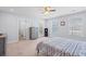 Bright, airy bedroom with blue accents, three windows and plush carpet at 3751 Copahee Sound Dr, Mount Pleasant, SC 29466