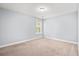 A carpeted bedroom features natural light from the window at 3751 Copahee Sound Dr, Mount Pleasant, SC 29466