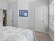 Relaxing bedroom featuring soft bedding, natural light, and unique wall art at 3751 Copahee Sound Dr, Mount Pleasant, SC 29466
