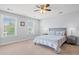 Comfortable bedroom with neutral tones, plush carpeting, and a ceiling fan, perfect for relaxation at 3751 Copahee Sound Dr, Mount Pleasant, SC 29466