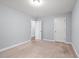 A carpeted bedroom features two doors and natural light from the window at 3751 Copahee Sound Dr, Mount Pleasant, SC 29466