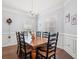 Charming dining room with a wooden table, seating for eight, and elegant chandelier at 3751 Copahee Sound Dr, Mount Pleasant, SC 29466
