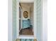 Welcoming entryway featuring a stylish blue cabinet and a round mirror at 3751 Copahee Sound Dr, Mount Pleasant, SC 29466