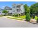 Charming home featuring double balconies, lush landscaping and a well-manicured lawn at 3751 Copahee Sound Dr, Mount Pleasant, SC 29466