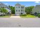 Beautiful home featuring double balconies, elevated design, and a well-maintained lawn at 3751 Copahee Sound Dr, Mount Pleasant, SC 29466