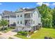 Stylish two-story home featuring double balconies, elevated design, and a well-maintained lawn at 3751 Copahee Sound Dr, Mount Pleasant, SC 29466