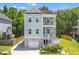 Charming two-story home with double balconies and lush landscaping surrounded by green trees at 3751 Copahee Sound Dr, Mount Pleasant, SC 29466