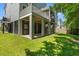 Backyard view showcasing raised deck and expansive green space, ideal for outdoor activities at 3751 Copahee Sound Dr, Mount Pleasant, SC 29466