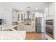 Modern kitchen features stainless steel appliances, a sleek range hood, and wooden floors at 3751 Copahee Sound Dr, Mount Pleasant, SC 29466