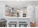 Eat-in kitchen boasts a breakfast bar, stainless steel appliances, and stylish pendant lighting at 3751 Copahee Sound Dr, Mount Pleasant, SC 29466