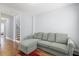 Living room features a gray sofa, wood floors, and a view of the staircase at 3751 Copahee Sound Dr, Mount Pleasant, SC 29466