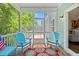 Inviting screened porch with comfortable seating, perfect for enjoying the outdoors at 3751 Copahee Sound Dr, Mount Pleasant, SC 29466