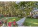 View of backyard featuring stone pathway, mature trees and a view of a gazebo at 3751 St Ellens Dr, Mount Pleasant, SC 29466