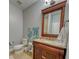 Bathroom with a vanity sink, toilet, and a dark wood-framed mirror at 3751 St Ellens Dr, Mount Pleasant, SC 29466