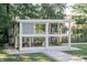 A well-maintained chicken coop stands in a spacious, green yard, complemented by a secure, fenced perimeter at 3751 St Ellens Dr, Mount Pleasant, SC 29466
