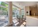 A bright dining area offers a great view from the floor to ceiling windows at 3751 St Ellens Dr, Mount Pleasant, SC 29466