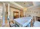 Dining room features a decorative chandelier, architectural columns, and seating for ten at 3751 St Ellens Dr, Mount Pleasant, SC 29466