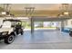 Clean and organized garage with a vehicle parked inside, showcasing the epoxy flooring at 3751 St Ellens Dr, Mount Pleasant, SC 29466