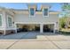 Three-car garage featuring ample parking, epoxy flooring, storage, and convenient driveway access at 3751 St Ellens Dr, Mount Pleasant, SC 29466