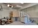 Functional garage featuring storage, a work area, epoxy floors, and convenient access to the home at 3751 St Ellens Dr, Mount Pleasant, SC 29466