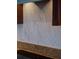 A close up of the kitchen backsplash, which features a chevron design and granite countertop at 3751 St Ellens Dr, Mount Pleasant, SC 29466