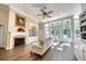 Living room featuring a fireplace, built-in shelving and light filled windows at 3751 St Ellens Dr, Mount Pleasant, SC 29466