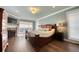 This is the main bedroom with a fireplace, sitting area, and light-filled windows at 3751 St Ellens Dr, Mount Pleasant, SC 29466