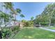 Well-manicured lawn, lush landscaping, and privacy fence surround this home for a serene outdoor space at 3751 St Ellens Dr, Mount Pleasant, SC 29466