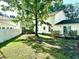 Spacious backyard features a deck, privacy fence, and mature trees at 3784 Scotts Mill Dr, North Charleston, SC 29420