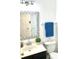 Bathroom features a decorative mirror, vanity, and toilet at 3784 Scotts Mill Dr, North Charleston, SC 29420