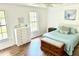 Bright bedroom features a chest, dresser, and wood floors at 3784 Scotts Mill Dr, North Charleston, SC 29420