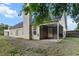 The backyard features a covered patio and well-maintained lawn at 402 Equinox Cir, Ladson, SC 29456