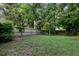 Fenced back yard with mature trees at 402 Equinox Cir, Ladson, SC 29456