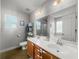 Bathroom featuring a double vanity, tiled floors, and storage shelves at 402 Equinox Cir, Ladson, SC 29456