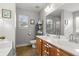 Bathroom featuring a double vanity, tiled floors, and storage shelves at 402 Equinox Cir, Ladson, SC 29456