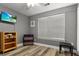 Bright bedroom featuring laminate floors, a window, and neutral wall colors at 402 Equinox Cir, Ladson, SC 29456