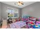 Bright bedroom with a large window and ample storage for toys at 402 Equinox Cir, Ladson, SC 29456