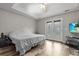 Bedroom with trey ceiling, french doors and access to backyard at 402 Equinox Cir, Ladson, SC 29456