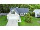 Charming one story home featuring a two-car garage, and landscaped front yard at 402 Equinox Cir, Ladson, SC 29456