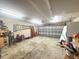 Spacious two car garage with ample storage shelves and overhead lighting at 402 Equinox Cir, Ladson, SC 29456