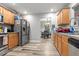 Functional kitchen with modern appliances, wooden cabinets, and an open layout at 402 Equinox Cir, Ladson, SC 29456