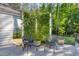 Serene backyard with comfortable seating surrounded by a beautiful, privacy-enhancing trellis at 4114 Maidstone Dr, Mount Pleasant, SC 29466