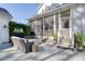 Charming backyard with a fire pit, comfortable seating, and a screened-in porch, great for relaxing outdoors at 4114 Maidstone Dr, Mount Pleasant, SC 29466