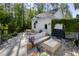 Backyard patio area with outdoor furniture, a fire pit, and lush greenery creating a private retreat at 4114 Maidstone Dr, Mount Pleasant, SC 29466