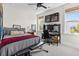This bright bedroom offers a ceiling fan, window, workspace, and comfortable gray bed at 4114 Maidstone Dr, Mount Pleasant, SC 29466