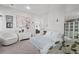 Bright and airy bedroom with soothing decor and a comfortable armchair at 4114 Maidstone Dr, Mount Pleasant, SC 29466
