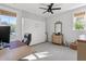 Bedroom with a murphy bed, large windows and a ceiling fan at 4114 Maidstone Dr, Mount Pleasant, SC 29466