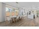 Bright dining room with hardwood floors, a modern table, and views of the kitchen at 4114 Maidstone Dr, Mount Pleasant, SC 29466